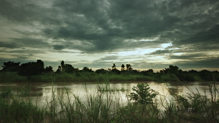 Time lapse shot of beautiful sunrise on the river.
