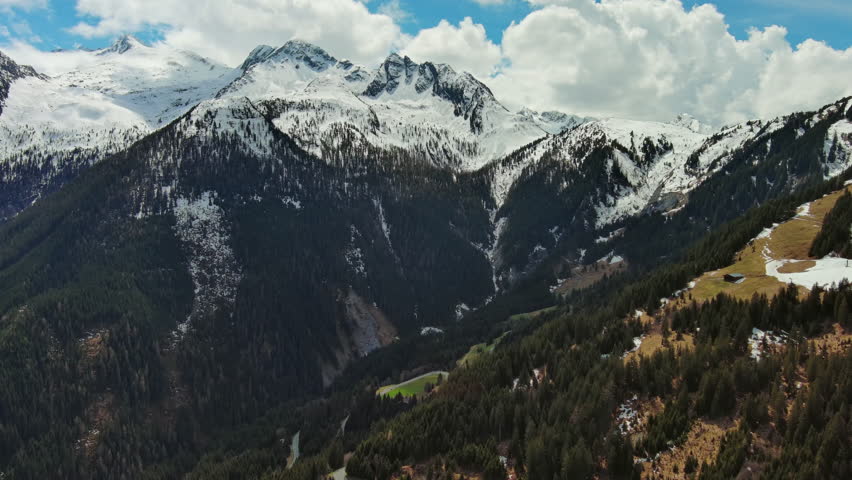 Aerial view of snowcapped mountains in clouds, Austrian Alps, Austria, 4k