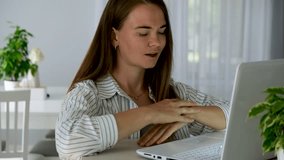 Stressed young woman at home using laptop. Anxiety and nervous tension before important online work or study task. Heavy breathing, worry, remote work and e-learning concept. Mental health at work. - Powered by Shutterstock - Get 15% off with code: PIKWIZARD15