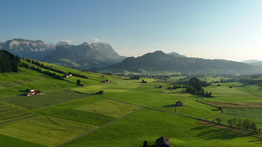Drone View of Verdant Fields and Majestic Mountains near Hoher Kasten in St. Gallen, Switzerland