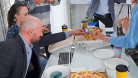 Colleagues enjoy pizza and coffee together in modern office. Informal lunch break creates teamwork, communication, and friendly atmosphere, showing corporate culture and relaxed business interaction. - Powered by Shutterstock - Get 15% off with code: PIKWIZARD15