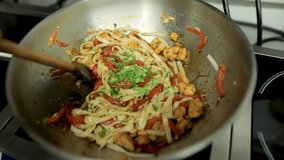 Sizzling stir fry featuring chicken, bell peppers, and noodles being tossed in a hot wok, showcasing vibrant colors and fresh ingredients for healthy dining. - Powered by Shutterstock - Get 15% off with code: PIKWIZARD15