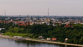 Plock, Poland, oil refinery in background highlights industrial impact on city - Powered by Shutterstock - Get 15% off with code: PIKWIZARD15
