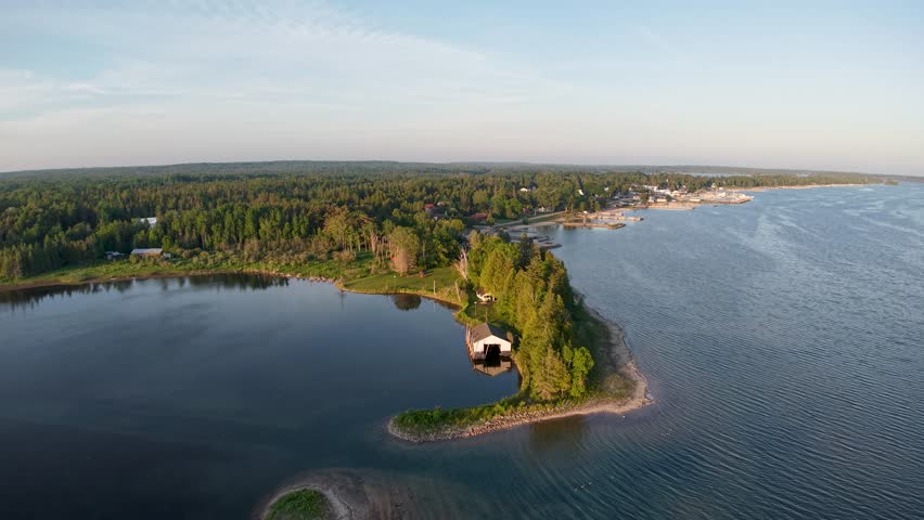 Aerial golden hour view of small bay and Hessel Michigan, Les Cheneaux