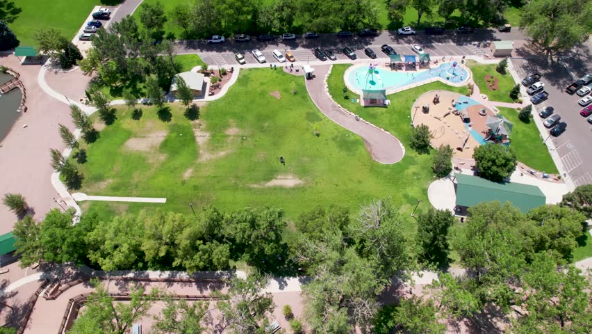 Aerial footage of splash pad in Centennial Park in Canon City Colorado. Camera pans to the right