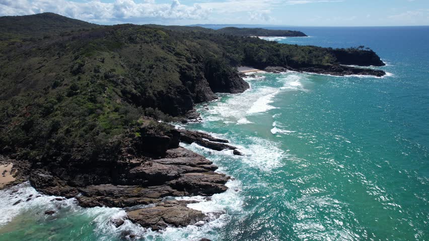 Noosa National Park And Its Rocky Coastline By The Coral Sea In Queensland, Australia. - aerial shot