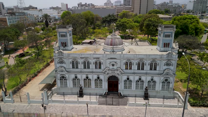 An aerial shot reveals the grand historic building of the Center for Military Historical Studies of Peru, located in the Parque de la Exposición in Lima