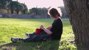 Young man wearing boxing gloves in park - Powered by Shutterstock - Get 15% off with code: PIKWIZARD15
