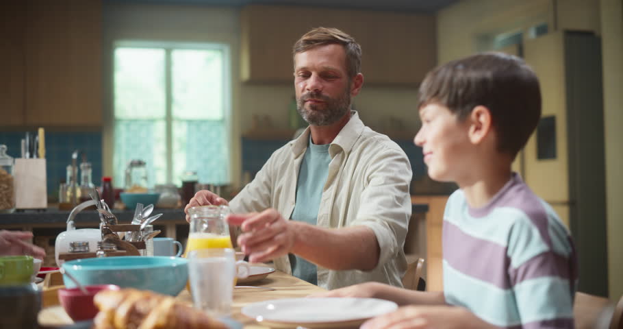 Parents and Children Gather in a Sunlit Kitchen, Enjoying Breakfast While Discussing Healthy Eating. Dynamic Family Meal Time, Energetic Family Sharing Meal with Lively Discussions, Daily Advice