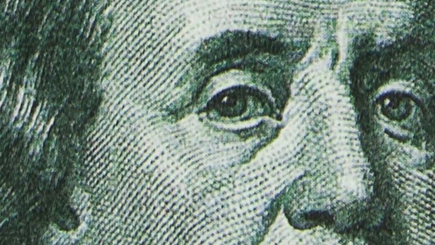 Dynamic close-ups of the details of a 100-dollar bill. Stop motion retro style. 4K.