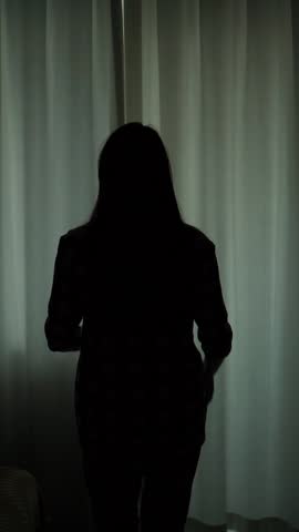 A young woman decisively opens the curtains, letting sunlight flood the room. From darkness to light, symbolizing hope, recovery, and readiness to face the world.
