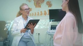 Healthcare Consultation with an Expectant Mother Ensuring the Best for Her and Baby. A qualified Doctor discusses ultrasound results with a patient at her prenatal checkup - Powered by Shutterstock - Get 15% off with code: PIKWIZARD15