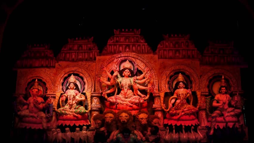 Sculpture of Indian gods and Goddess Durga in Durga Puja festival with color changing lights, Navratri celebration, Hindu religious background, traditional culture, divine worship video