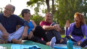Group of diverse senior people having fun together after yoga class at city park - Healthy, sport and elderly lifestyle concept - Powered by Shutterstock - Get 15% off with code: PIKWIZARD15