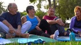 Group of diverse senior people having fun together after yoga class at city park - Healthy, sport and elderly lifestyle concept - Powered by Shutterstock - Get 15% off with code: PIKWIZARD15