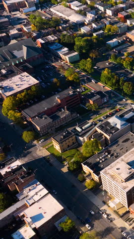 Aerial top view of residential low-rise buildings with green trees in downtown Albany, New York. Vertical video.