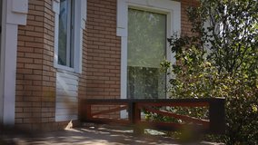 Girl thief dressed in black mask and outfit climbs out the house window, throwing down a bag with stolen items and suitcase full of valuables. - Powered by Shutterstock - Get 15% off with code: PIKWIZARD15