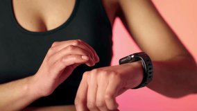 Extreme Close Up of Female Athlete Using Sports Watch – 4K Ultra HD Stock Video of Woman Runner Checking Fitness Tracker, Sports Technology, Training Performance, and Workout Monitoring - Powered by Shutterstock - Get 15% off with code: PIKWIZARD15