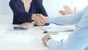 Business executives shaking hands, colleagues clapping after sealing significant partnership, expressing professional success and collaborative achievement in corporate environment. Handshake close up - Powered by Shutterstock - Get 15% off with code: PIKWIZARD15