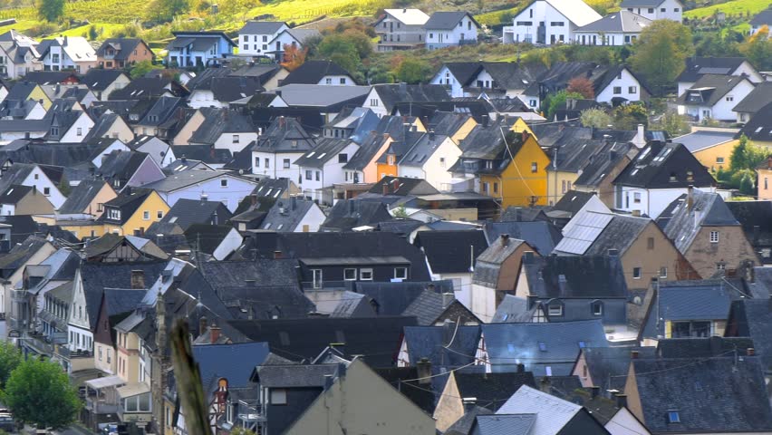  Many colorful homes in historic Bremm village along Moselle river during autumn time.