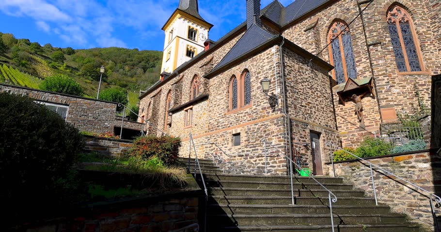 St Laurentius church  against blue sky in Bremm village along Moselle river in Germany. In autumn time.