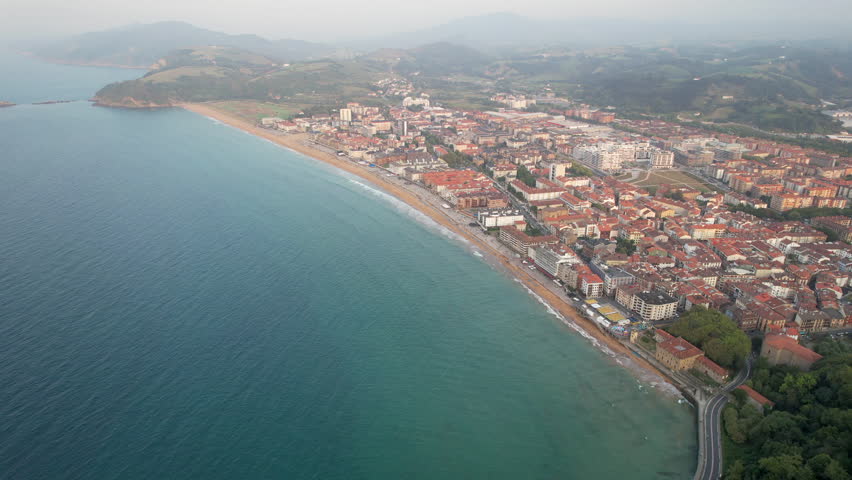 Drone footage of Zarautz town on summer evening. Gipuzkoa, Basque Country, Spain.