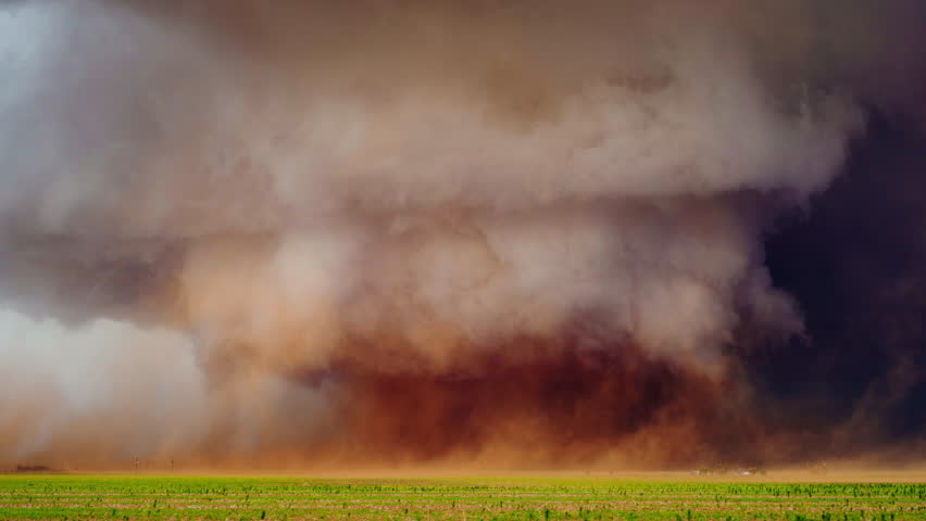 A destructive tornado spins violently beneath a severe thunderstorm supercell, with rotating clouds, flying debris, and dark skies showcasing the raw power of extreme weather