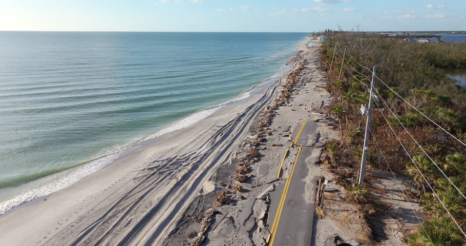 Storm surge destroyed oceanfront road on Gulf coast after hurricane in Florida. Severe damage to transportation infrastructure