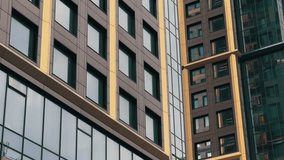 Modern Skyscrapers Low Angle Panoramic View | Contemporary High-Rise Buildings with Glass Facades | Urban Architecture Upward Tilt Movement - Powered by Shutterstock - Get 15% off with code: PIKWIZARD15