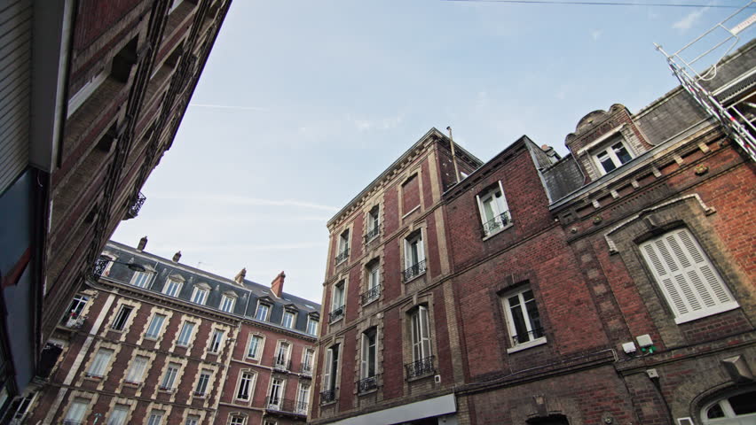 Walking along the streets of Rouen France showing beautiful historic buildings facades cityscape of European tourist city architecture.