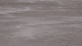 Abstract background of sand blowing across a beach by the wind. Sense of loneliness and isolation away from others and nature England UK 4K  - Powered by Shutterstock - Get 15% off with code: PIKWIZARD15
