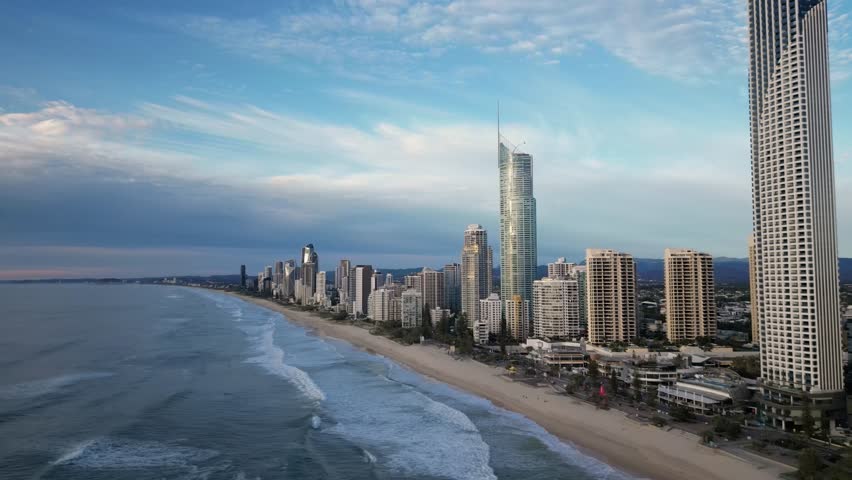 aerial of surfers paradise skyline moving out over the ocean, gold coast, queensland, australia 4k video