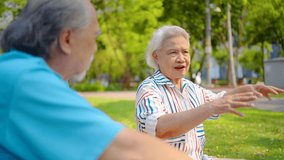 Senior asian man and woman couple of best friend enjoy a delightful picnic under the trees, sipping orange juice and sharing laughter in a park, creating lasting memories together, talk and relax - Powered by Shutterstock - Get 15% off with code: PIKWIZARD15