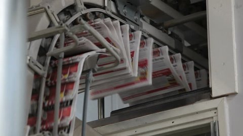 printed newspapers ready for folding