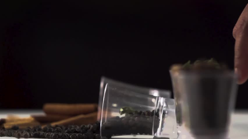 Stylise shot of whole spices on black background. Cinematic Food stock footage.