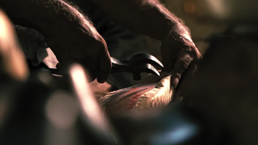 Man making traditional Indian foot wear. Indian Punjabi jutti.