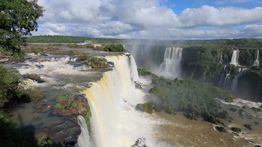 Iguazu Falls, waterfalls of Iguazu River on border of Argentine and Brazilian state of Parana. Panoramic view of magnificent natural wonder of the world. Brazil side. Brazilian wilderness landscape.