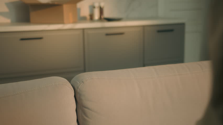 African American carefree relaxed woman falling on couch relaxing smiling enjoying pause on sofa air conditioner girl female happy rest homeowner moving day relocation to own home apartment mortgage