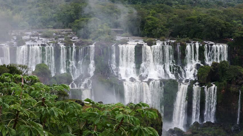 Iguazu Falls, waterfalls of Iguazu River on border of Argentine and Brazilian state of Parana. Panoramic view of magnificent natural wonder of the world. Brazil side. Brazilian wilderness landscape.