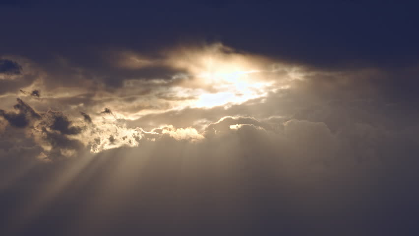 Sunlight Rays Breaking Through Dark Clouds