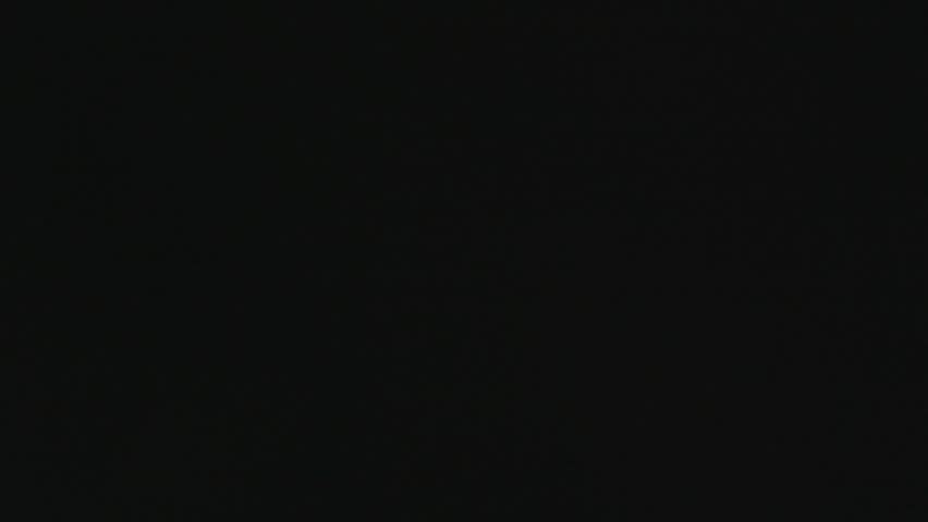 Fireworks Spark Through Smoke Above Festival Crowd in Mexico Night. High quality 4K footage