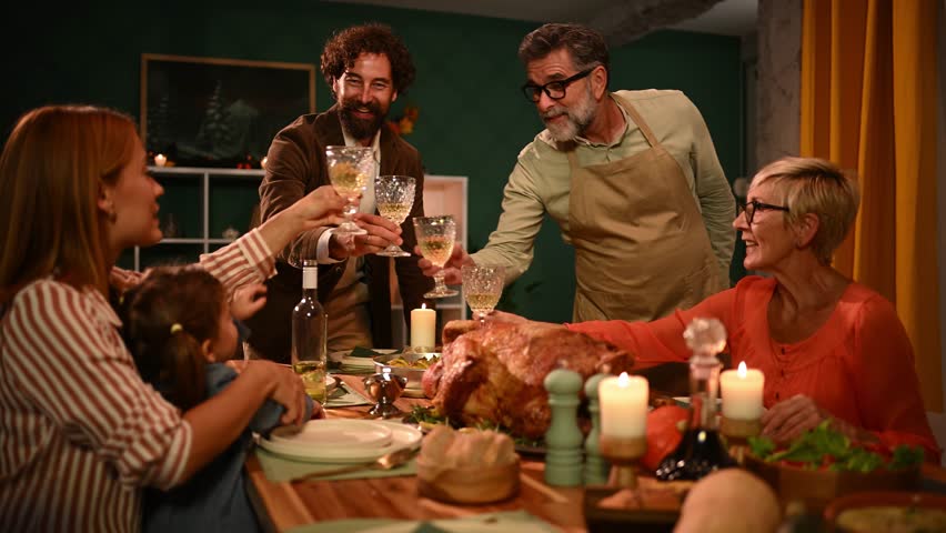 Family members are toasting during thanksgiving dinner, celebrating togetherness and gratitude