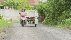 Animal shelter volunteer transports six adopted dogs in a custom built sidecar attached to her scooter, showcasing a heartwarming scene of animal rescue and care - Powered by Shutterstock - Get 15% off with code: PIKWIZARD15