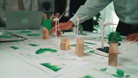 Green Energy Concept with Wind Turbines and Environmental Models on Table in Office Setting for Sustainable Business Development SACTR - Powered by Shutterstock - Get 15% off with code: PIKWIZARD15