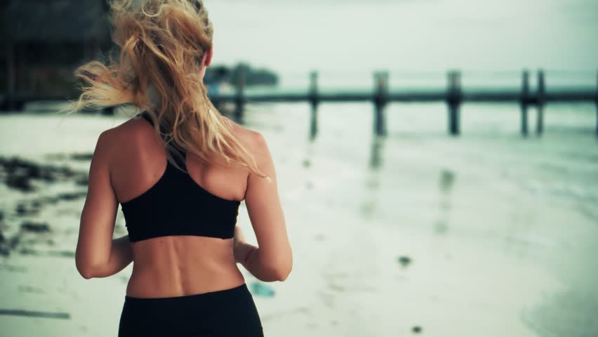 Woman Running On Beach By Ocean, Female Athlete Exercising. Fitness Training Healthy Lifestyle Activity. Sporty Woman Jogging, Runner Exercise. Physical Wellness, Mindful Movement, Running Workout - Powered by Shutterstock - Get 15% off with code: PIKWIZARD15