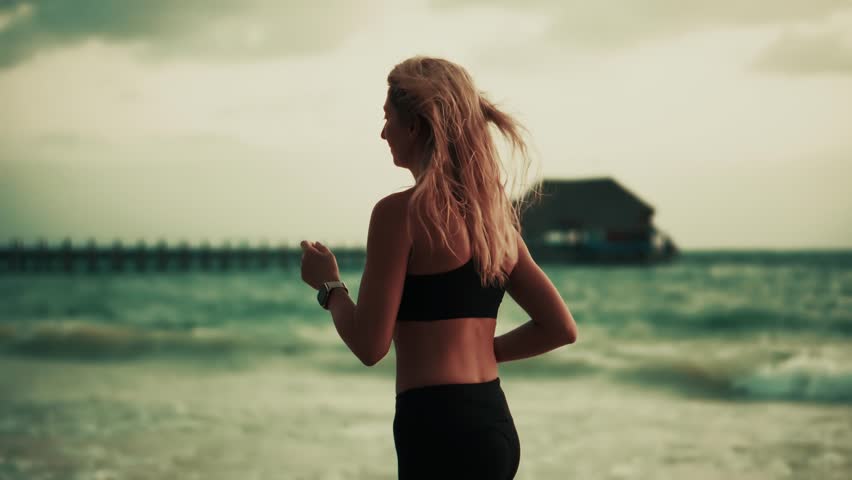 Woman Running On Beach By Ocean, Female Athlete Exercising. Fitness Training Healthy Lifestyle Activity. Sporty Woman Jogging, Runner Exercise. Physical Wellness, Mindful Movement, Running Workout - Powered by Shutterstock - Get 15% off with code: PIKWIZARD15