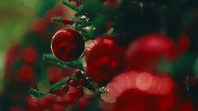 Festive Christmas wreath made of lush green pine branches, decorated with red berries, golden ornaments, pinecones and a bright ribbon, hanging on a rustic wooden door for holiday season decor. - Powered by Shutterstock - Get 15% off with code: PIKWIZARD15