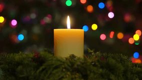 Romantic festive Christmas holiday evening. lit  candles on indoor Advent wreath. Romantic festive candlelight with tranquil bokeh lights and dark copy space. Looped 3D animation background. - Powered by Shutterstock - Get 15% off with code: PIKWIZARD15