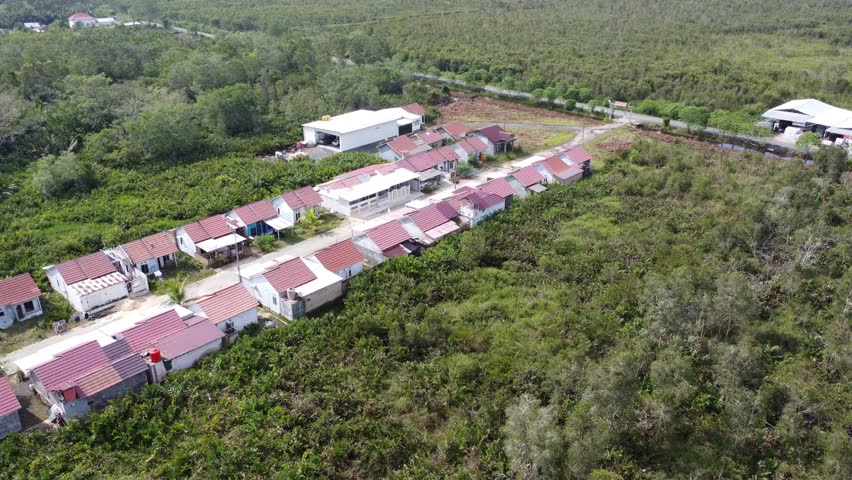 Aerial view of a housing complex with small plots of land so that only a few houses are built