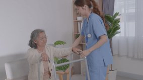 Asian young nurse helping senior elderly woman physical therapy walk with crutches in a nursing home. Physiotherapist, Doctor assist Disabled Patients. older health care. Walker or Standard Walker. - Powered by Shutterstock - Get 15% off with code: PIKWIZARD15